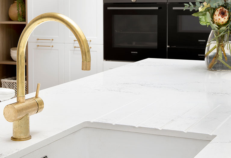 Gold features in a white kinsman kitchen