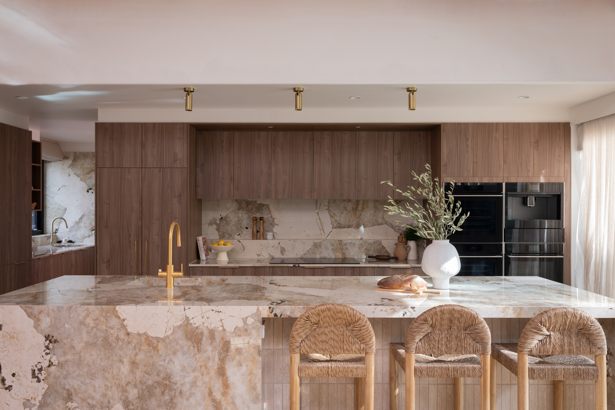 MA136 Large timber look kitchen with stone island bench and gold tap and handles