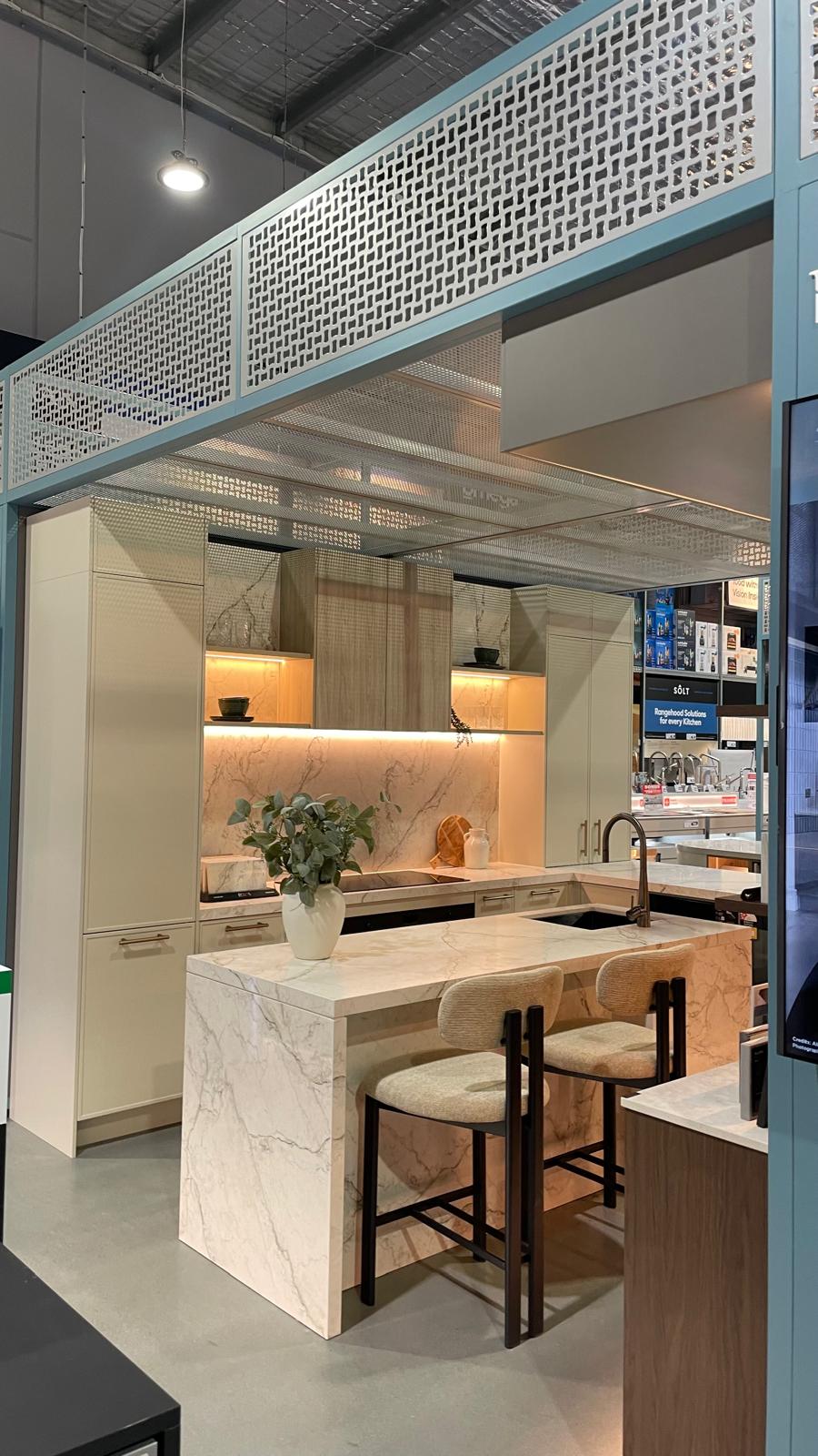 Designer Range kitchen with rich timber/dark cabinetry with an undermount sink.