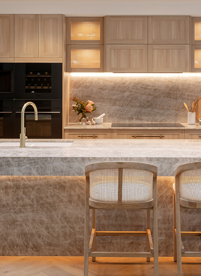 block24-h1 Kinsman kitchen from The Block featuring warm timber cabinetry and a stone island