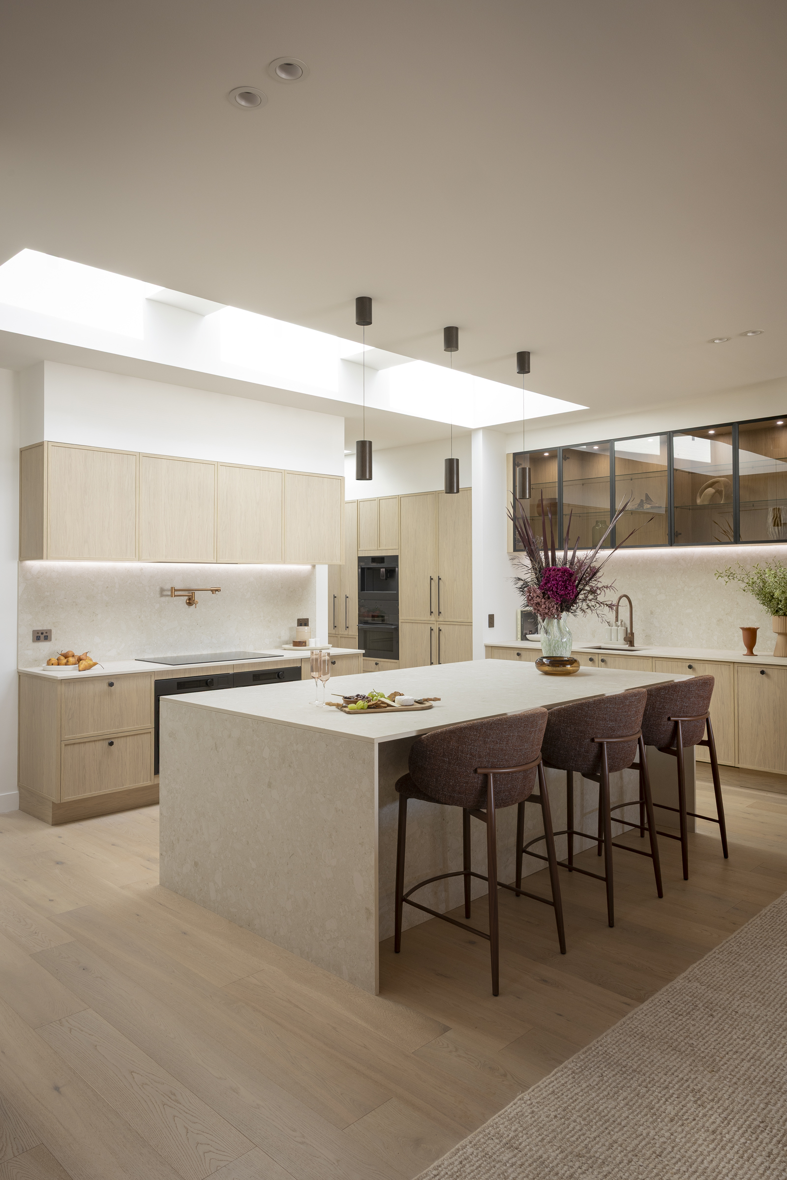 Adam and Jolene’s Block 2026 kitchen with Dekton Ava waterfall island and oak-toned cabinetry