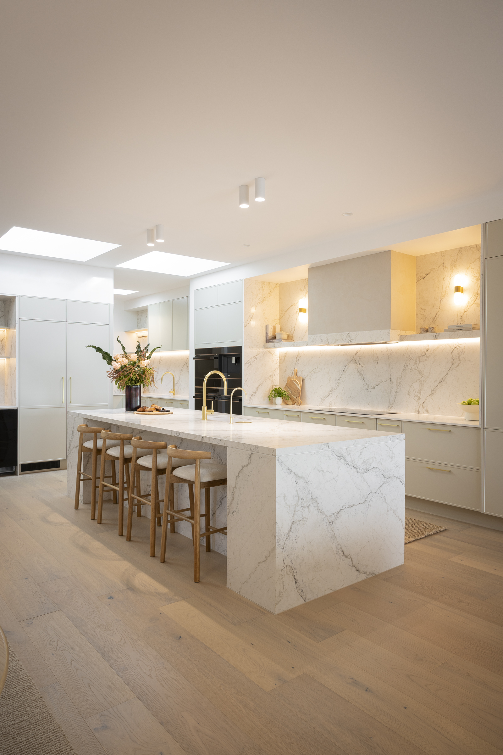 Chantel and Wyatt’s kitchen with Eclos Wondr waterfall island and white Shaker-style cabinetry