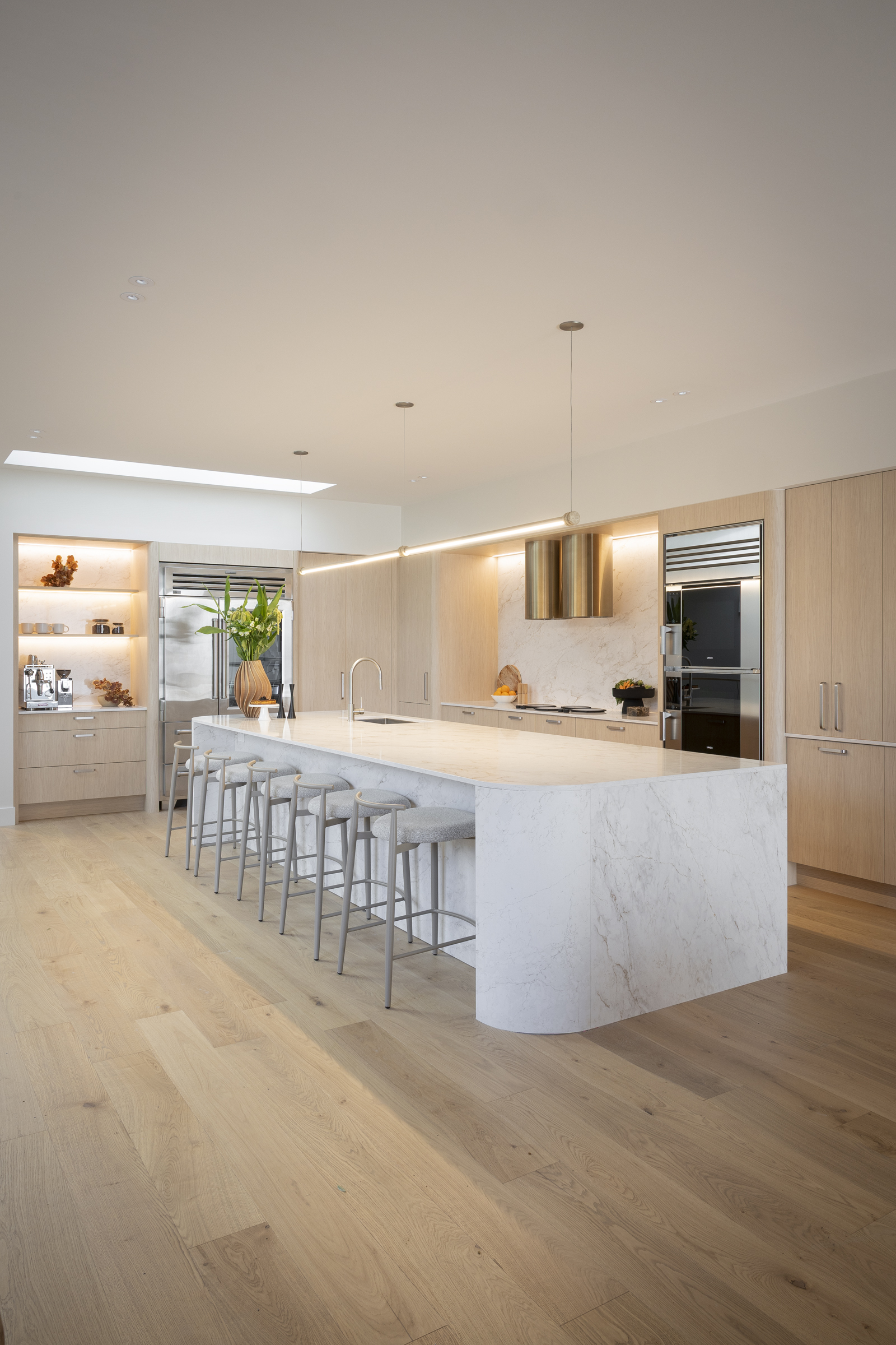 Courtney and Sev’s kitchen with Eclos Landr island and curved waterfall end