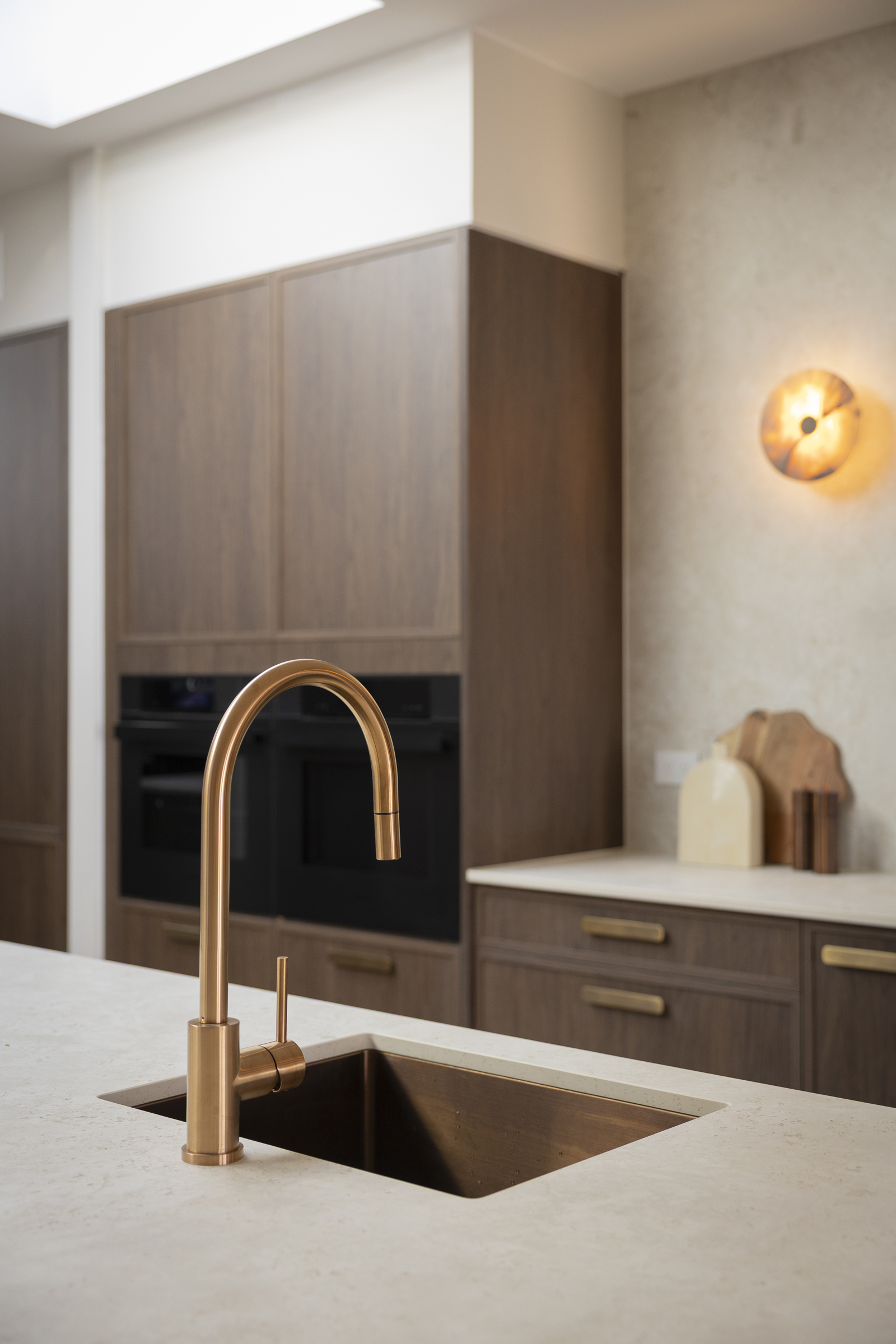 MA544 Brushed copper kitchen tap and matching sink with dark timber cabinetry in Lisa & Rosco’s kitchen on The Block 2026